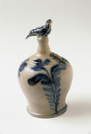 ‘Crocks, Jugs and Jars: Decorated American Stoneware,’ an exhibition at the Brandywine River Museum through July 10, includes examples on loan from public institutions and private collectors. Attributed to Philadelphia maker Richard C. Remmey, this cobalt decorated coin bank, circa 1880-1890, is topped with a fanciful bird finial molded by hand. Image collection of Winterthur Museum.